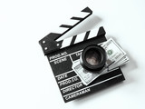 Clapperboard and dollars