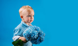 Childrens day. Small baby boy. Summer. Mothers or womens day. New life concept. Spring holiday. Little boy at blooming flower. Spring flowers. Childhood. Spring collection