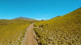 Close in on road through valley of mountains high peaks and glaciers near San Pedro de Atacama desert in the north of Chile.