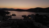 Aerial footage of greek seaport at twilight
