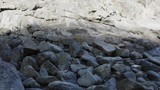 Flying over a rocky outcrop on a Costa Rica beach. Cinematic 4K drone footage.