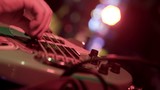 Person Playing Bass Guitar in Band Close Up in Slow Motion