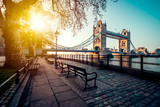 A boulevard next to the river Thames with Tower Bridge in the distance