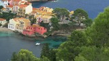 Asos (Assos), Greece. Scenic view of resort houses on a sea coast. Asos is a village on Cephalonia (Kefalonia) island in Ionian Sea in Western Greece. 4K