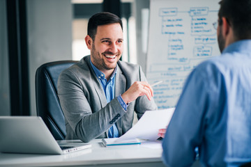 Handsome hr talking to a job candidate.