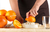 girl preparing fresh citrus juice