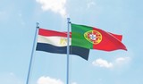 Portugal and Egypt, two flags waving against blue sky. 3d image