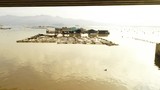 Flying over floating fish farms in China.