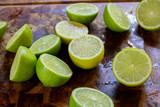 Fresh juicy lemons on a cutting board on a rustic wooden background