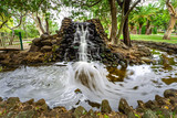 Beautiful man-made waterfall in Macintosh Island park. Surfers Paradise, Queensland, Australia