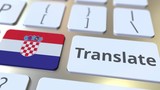 TRANSLATE text and flag of Croatia on the buttons on the computer keyboard. Conceptual 3D animation