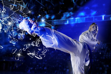 Woman in kimono practicing. Breaking glass