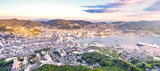 Business concept, modern cityscape of nagasaki dusk from mount inasa, the new top 3 nightview of the world, aerial view, copy space