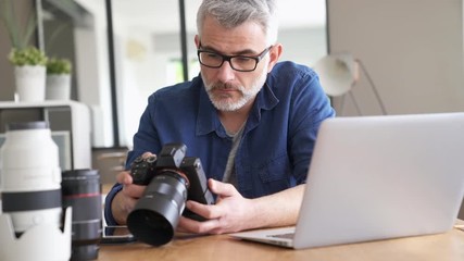 Photographer in office checking shots