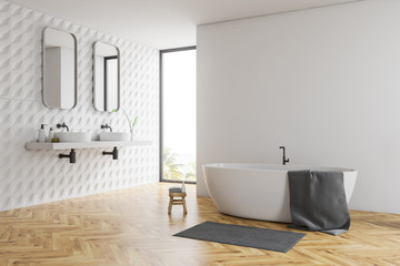 White bathroom corner, tub and sinks