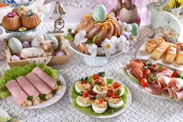 easter table with traditional dishes and cakes