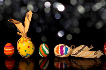 beautiful colorful, painted Easter eggs on a shiny background
