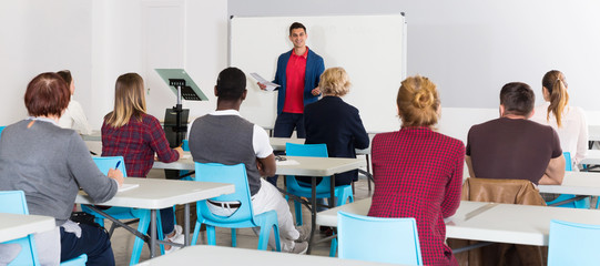 Male student answering at whiteboard