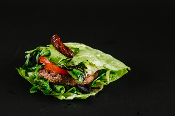 Grilled cutlet with vegetables an leaves of salad