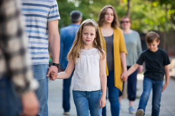 Cheerful father with little glad daughter