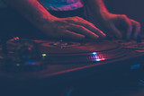 Close up of DJ mixing the track
