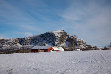 Old farm in Norwegian winter landscape