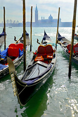 Venice, traditional gondola and basilica view