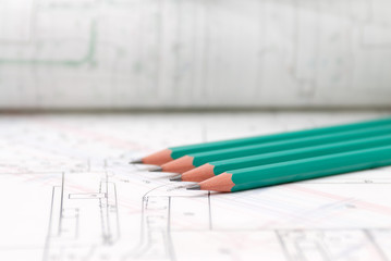 Architectural plans lying on drawing board