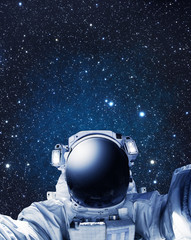 Astronaut in outer space, stars in the background - Some elements of this image furnished by NASA