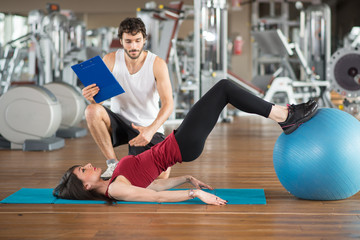 Woman training gym fitness ball