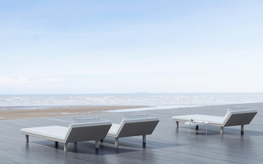 View of daybed with side table and wood terrace on sea view background. 3D rendering