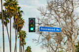 street name Rosewood Avenue in Hollywood with red traffic light