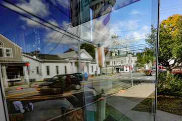 Pine Plains, New York USA Main Street USA and reflection from barbershop window.