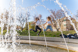 happy girlfriends playing in the park