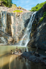 The stones are stacked at the waterfall.