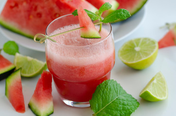 Watermelon smoothie  with lemon and mint to cool down on hot days. Refreshening fruit drink  for hot summer days.