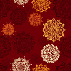 Seamless vector pattern with mandalas in red colors