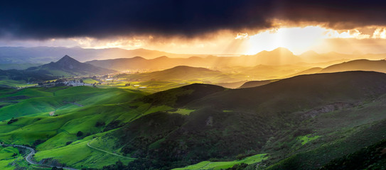Panorama of Mountains and Sunlight and Hills