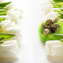 Easter pattern. White tulips, nest, eggs on white.