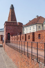 City wall with red brick towers in Warsaw