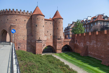 City wall with red brick towers in Warsaw