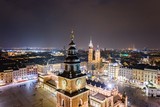 Aerial drone view Cracow old town and city main square at night.