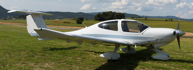 Sport airplane standing on airfield