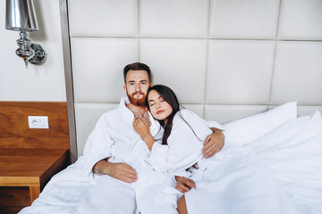 Picture showing happy couple resting in hotel room