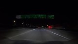 Hollywood Freeway sign night car mount driving shot in Los Angeles, California.