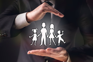 Concept For Family Insurance with Businessman on Dark Background