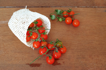 Small Tomato spill out of basket.Food concept.