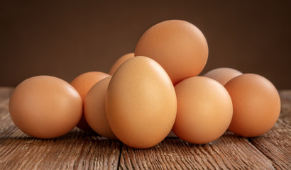 pile of chicken eggs on wooden background