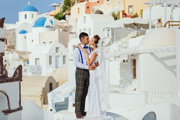 Young couple on Santorini island background