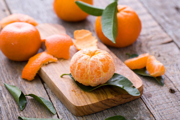 Fresh organic tangerines on wood.